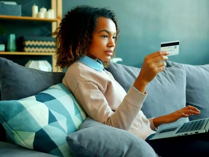 Woman shopping online from her couch